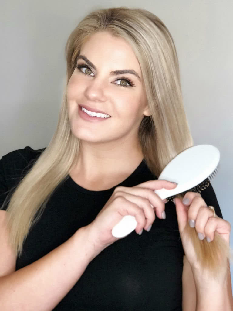 Me using my marula oil detangling brush on my hair