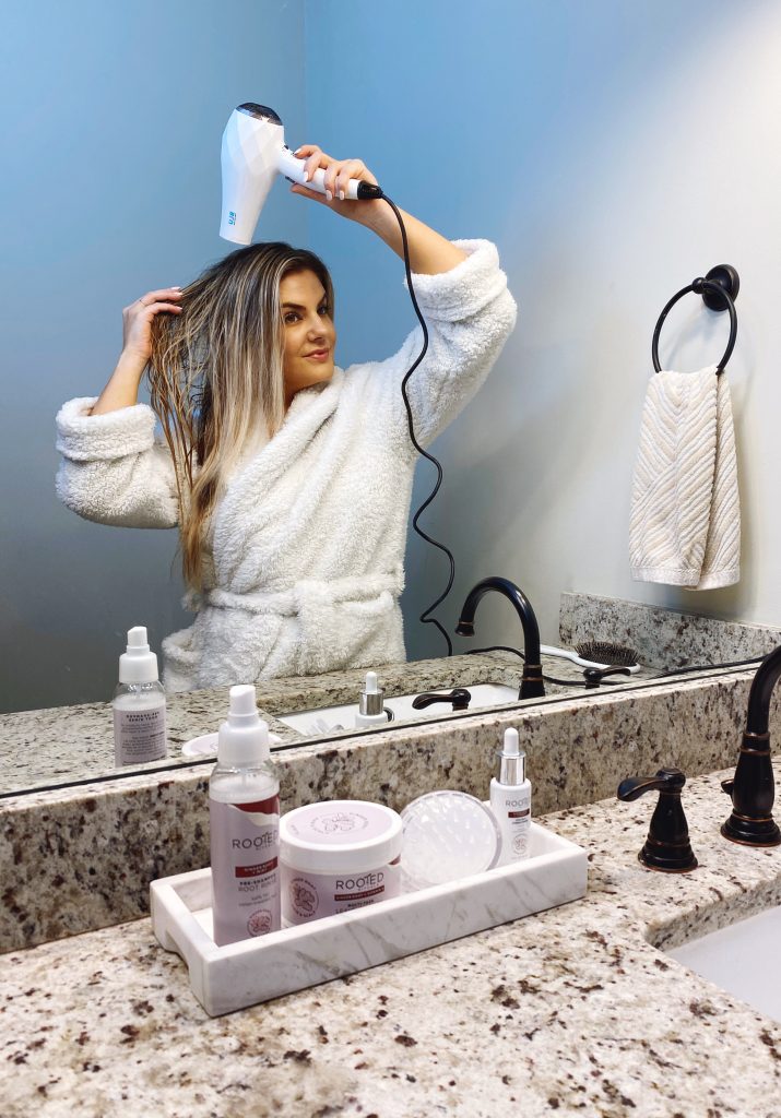 Me using Rooted Rituals scalp care products in my haircare routine