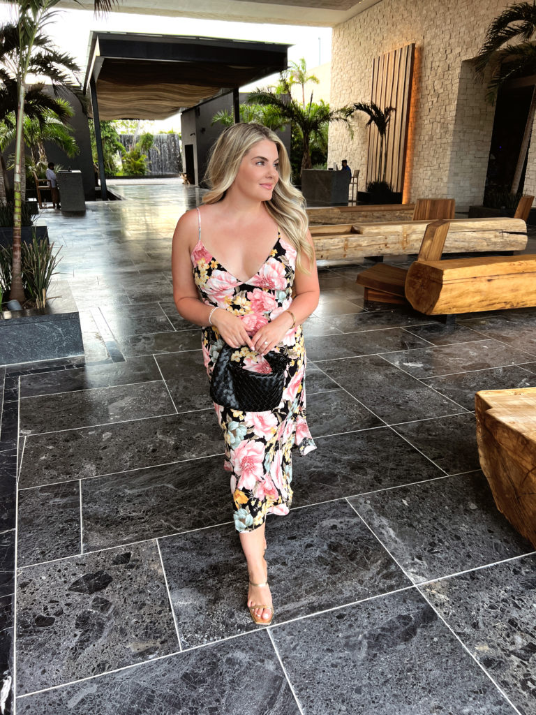 Lauren Erro in a floral midi dress