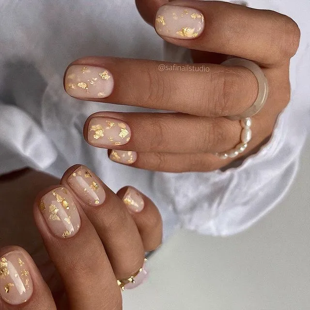 glossy-Nude-Gold-Foil-Nails- 2023 fall nail trends
