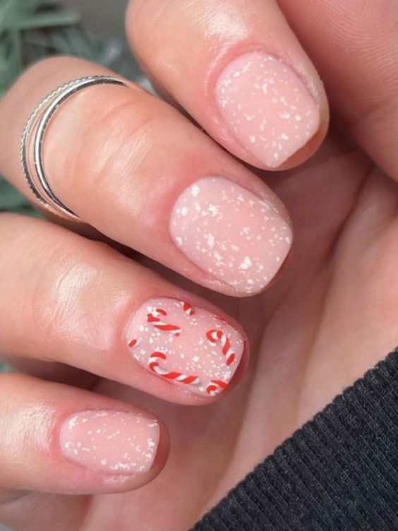 neutral nails with candy cane accent