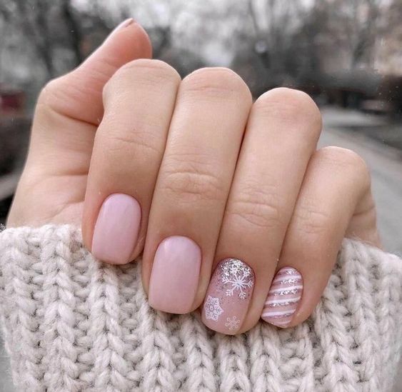 short holiday nail ideas neutral with snowflake and stripe accent